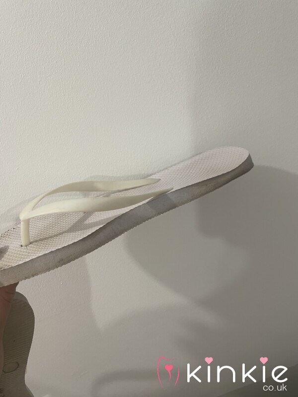 Well Worn White Flip Flops